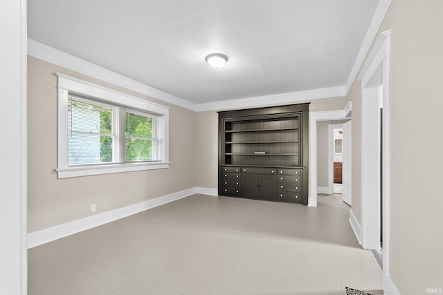 unfurnished bedroom with ornamental molding