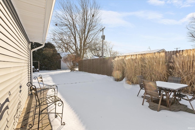 view of yard layered in snow