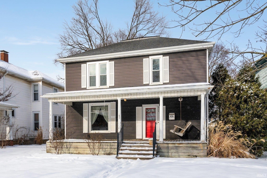 front of property featuring covered porch