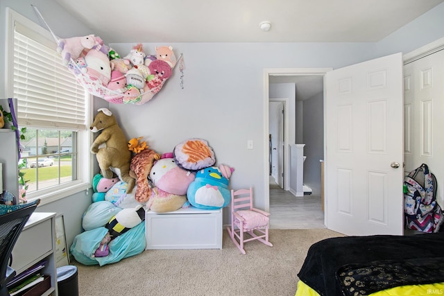 bedroom featuring light colored carpet