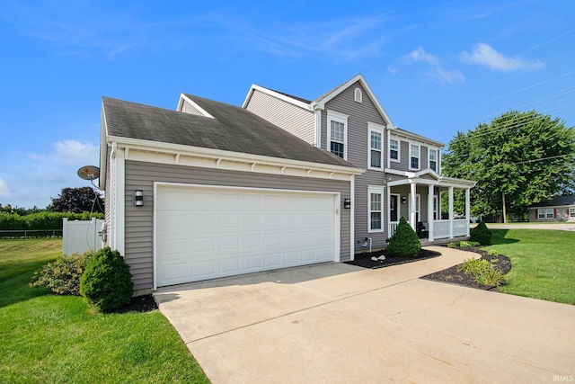 view of front of house featuring a porch, a front lawn, and a garage