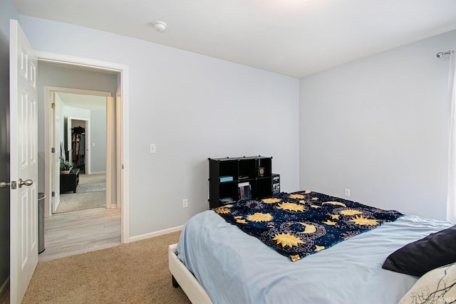 bedroom featuring light carpet