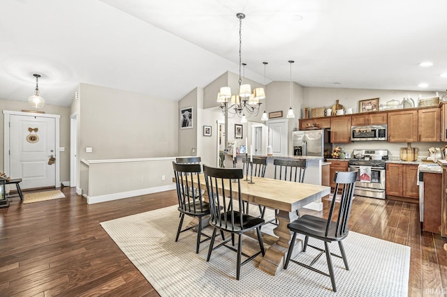 dining room with dark hardwood / wood-style flooring, vaulted ceiling, and a chandelier