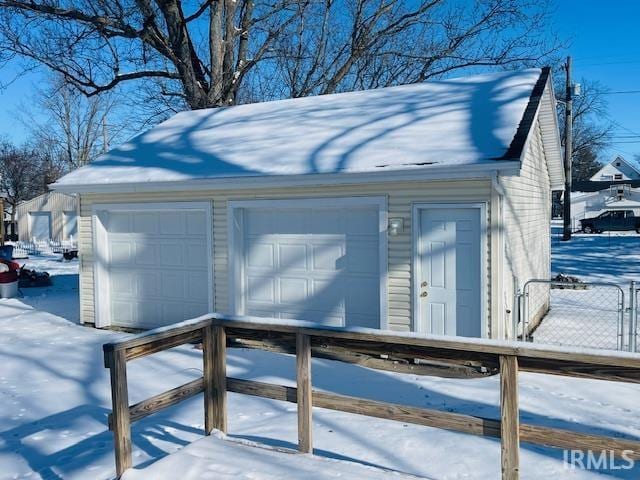 exterior space featuring an outbuilding and a garage