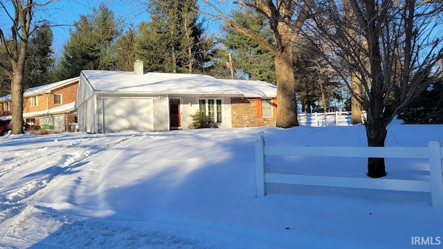 ranch-style house featuring a garage