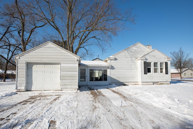 single story home featuring a garage