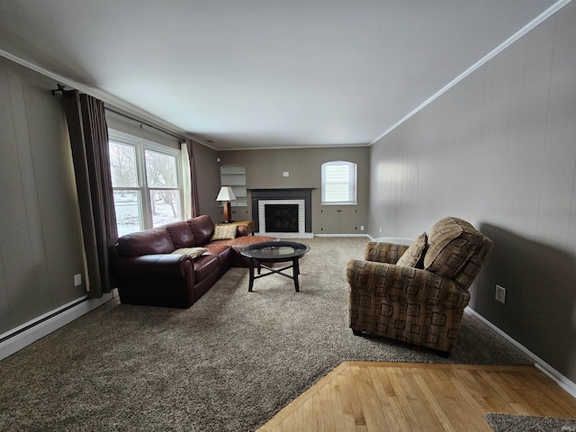 living room with ornamental molding, a brick fireplace, and hardwood / wood-style floors