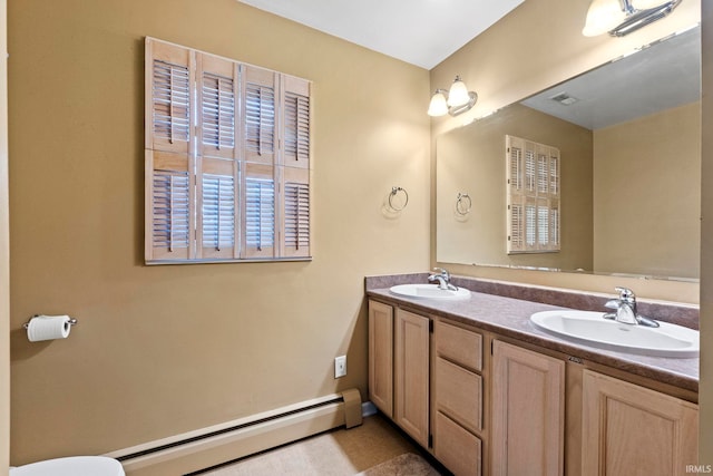 bathroom featuring vanity and a baseboard heating unit