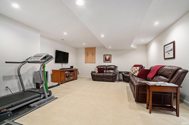 exercise area featuring light colored carpet