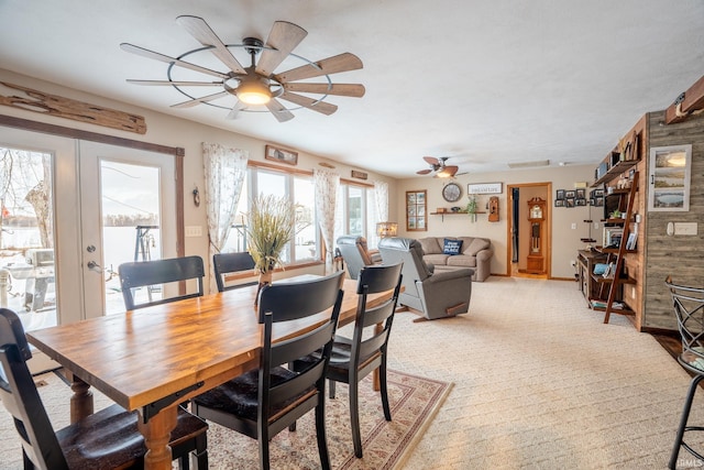 dining room with french doors and ceiling fan