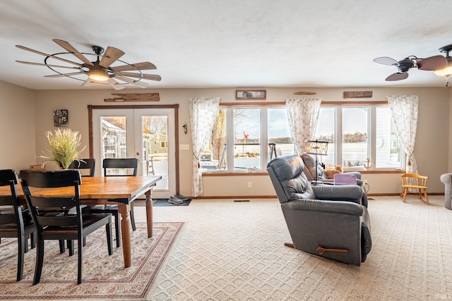 interior space featuring a healthy amount of sunlight, ceiling fan, and french doors