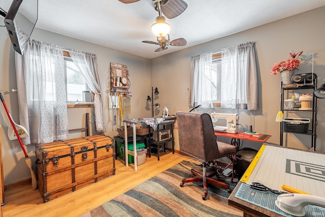 home office with ceiling fan and hardwood / wood-style floors