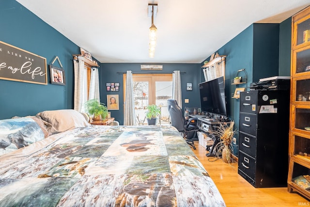 bedroom with light hardwood / wood-style floors