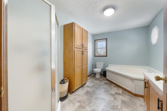 full bathroom featuring plus walk in shower, a wealth of natural light, vanity, and toilet