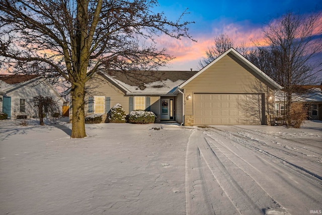 ranch-style house featuring a garage