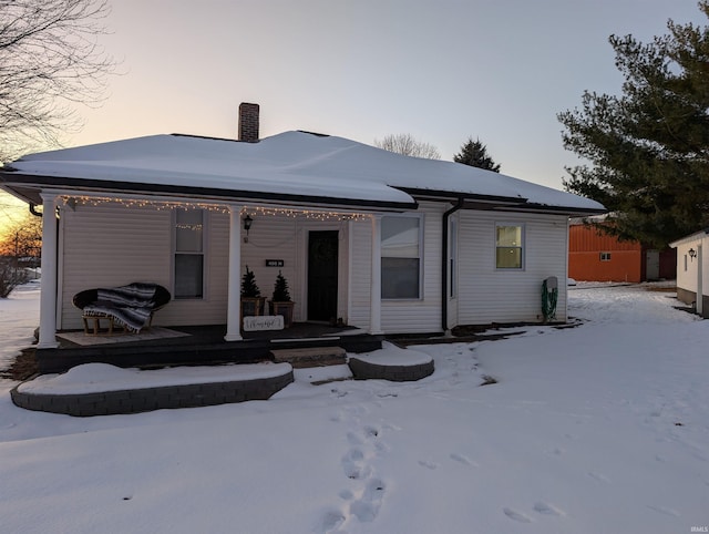 view of snow covered house