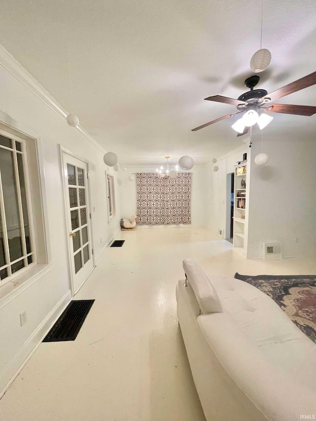 living room with a textured ceiling, ceiling fan, and crown molding