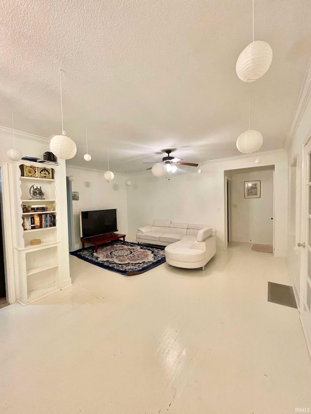 living room featuring ceiling fan, crown molding, and a textured ceiling