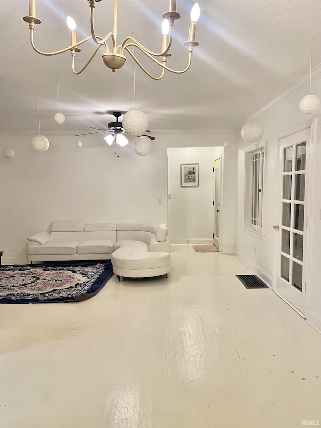 living room featuring ceiling fan with notable chandelier, ornamental molding, and hardwood / wood-style flooring