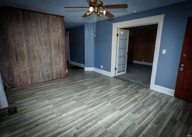 unfurnished room featuring ceiling fan and light wood-type flooring