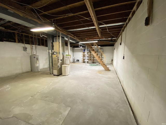 basement featuring water heater and heating unit