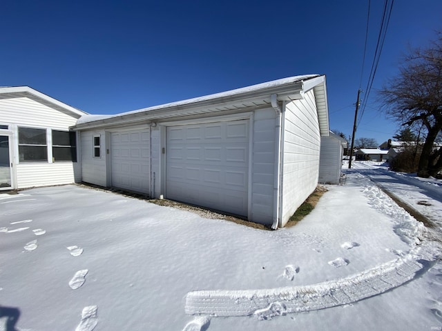 view of snow covered garage