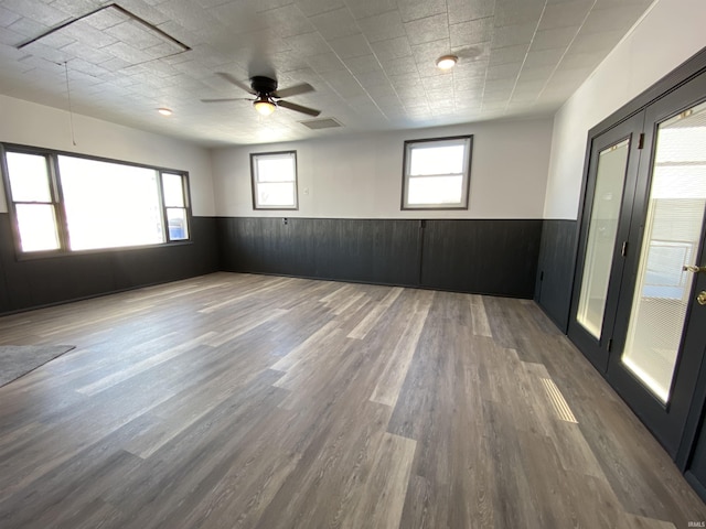 empty room featuring ceiling fan and hardwood / wood-style flooring