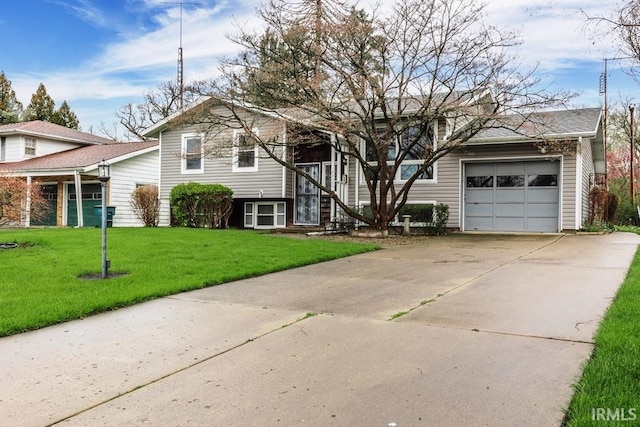 view of front of house with a front yard and a garage