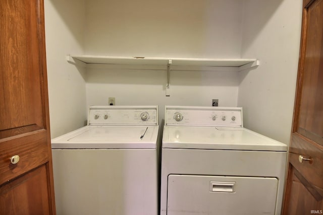 laundry room with independent washer and dryer