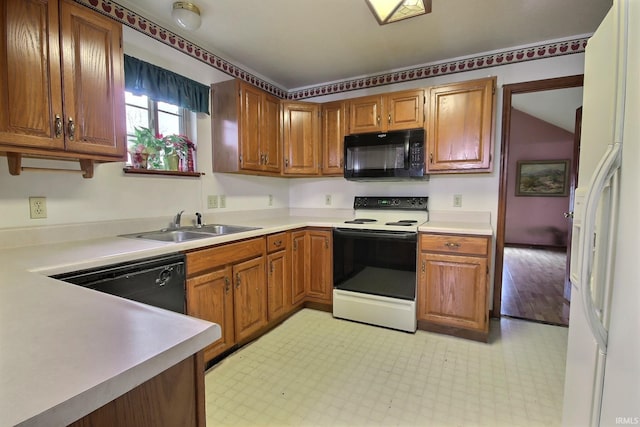 kitchen featuring sink and black appliances