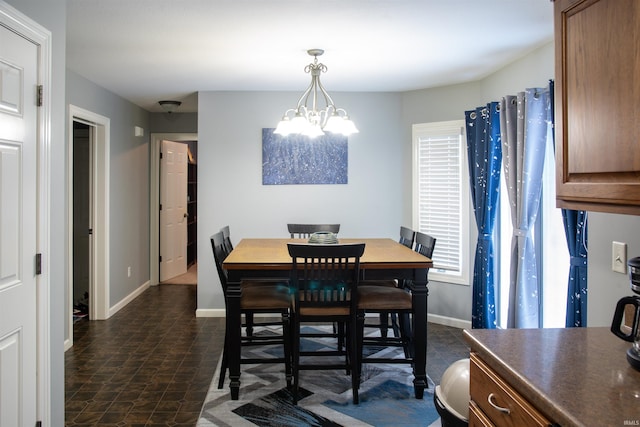 dining space with a notable chandelier