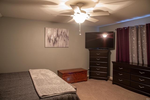 bedroom featuring light colored carpet and ceiling fan