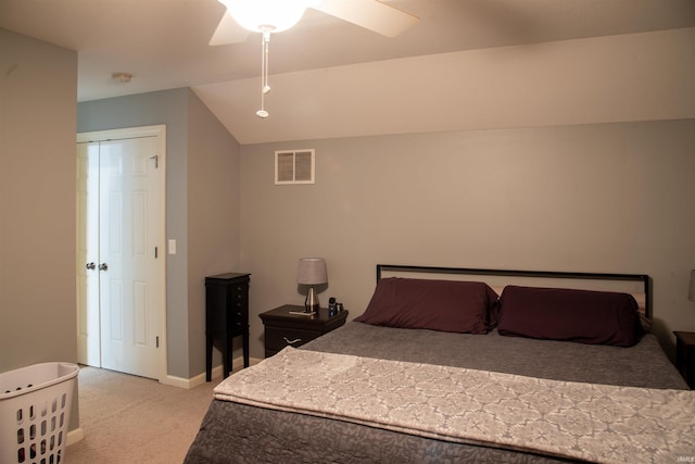 carpeted bedroom with lofted ceiling and ceiling fan