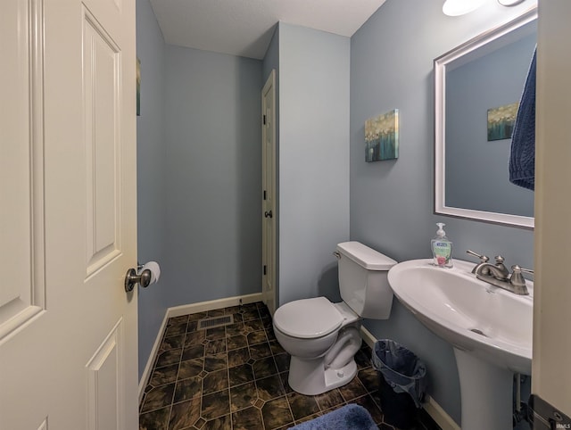 bathroom with toilet and sink