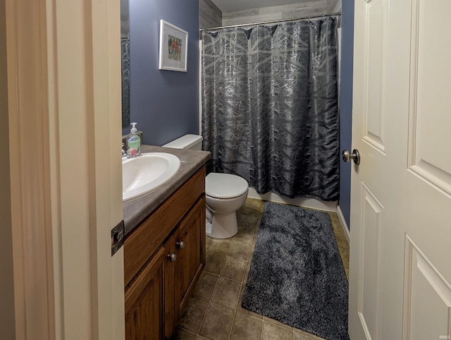 bathroom featuring toilet, vanity, and a shower with curtain