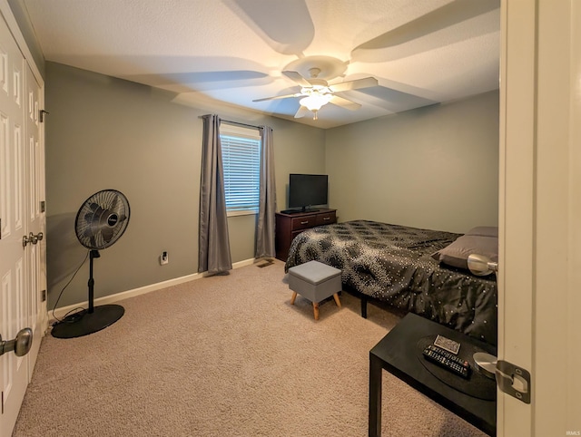 bedroom featuring ceiling fan and carpet flooring