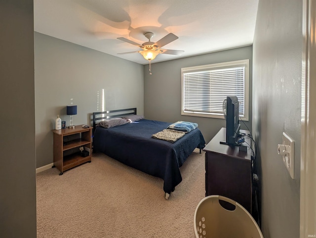 bedroom featuring ceiling fan and light colored carpet