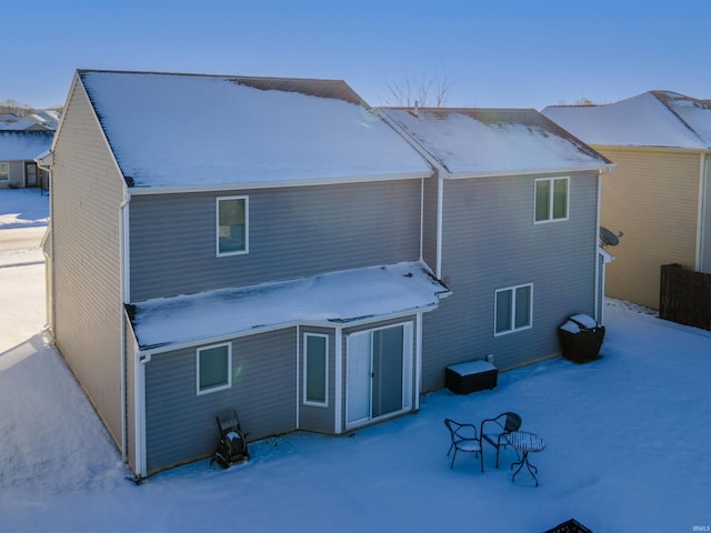 view of snow covered house