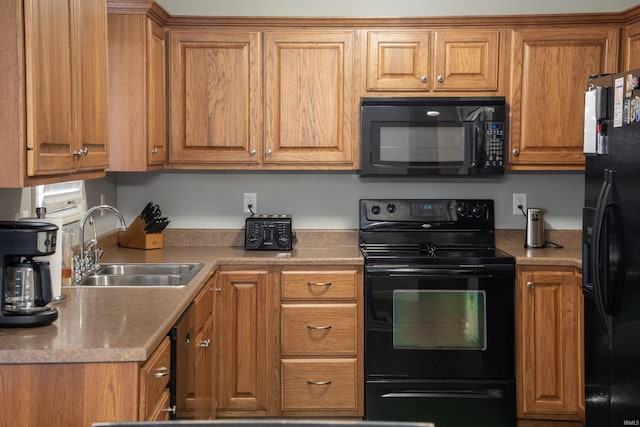 kitchen featuring black appliances and sink