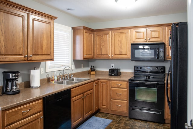 kitchen featuring black appliances and sink