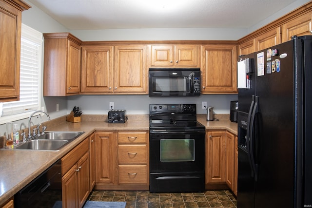 kitchen featuring sink and black appliances