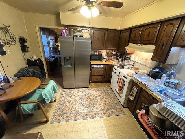 kitchen featuring ceiling fan, electric stove, stainless steel refrigerator with ice dispenser, and dark brown cabinetry