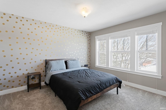 carpeted bedroom featuring multiple windows