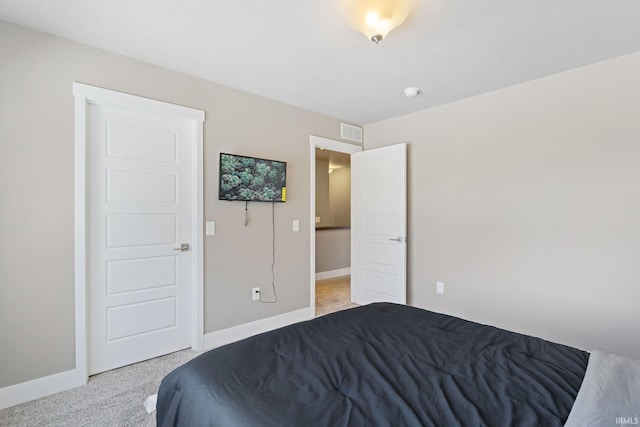 bedroom with light colored carpet