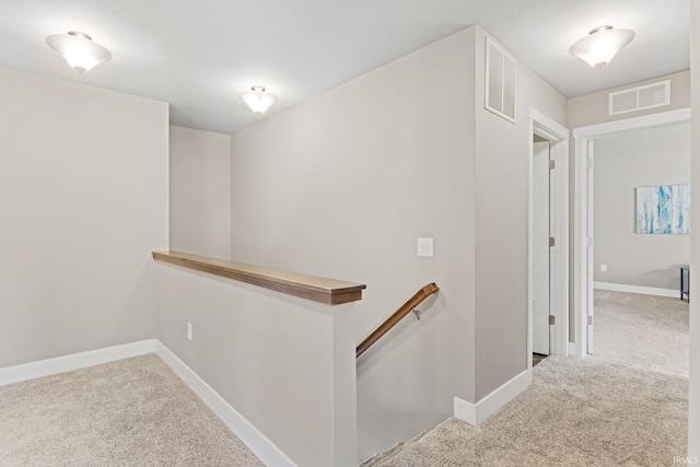 hallway featuring carpet flooring