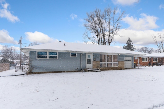 view of snow covered house