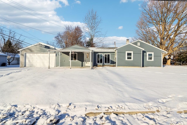 single story home with covered porch and a garage