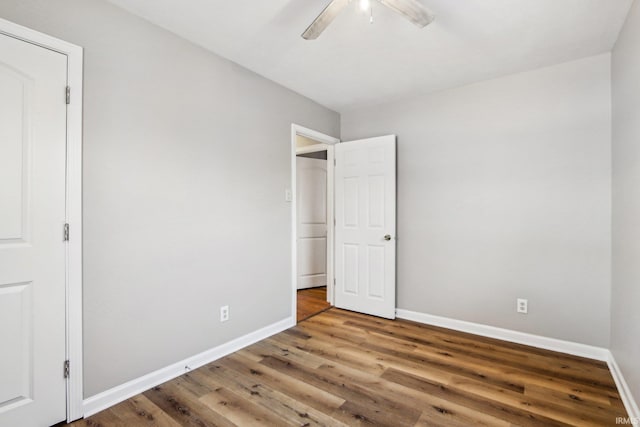 unfurnished bedroom featuring ceiling fan and hardwood / wood-style flooring