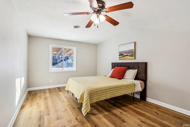 bedroom featuring ceiling fan and light wood-type flooring