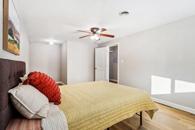 bedroom with hardwood / wood-style flooring and ceiling fan